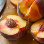 What brings out the flavor of peaches?, photo taken with an amateur photo from Reddit. Taken with an iPhone 15 Pro, top down-view, overhead shot, high quality, realistic, close to the camera, in a beautiful kitchen, --ar 16:9 --style raw